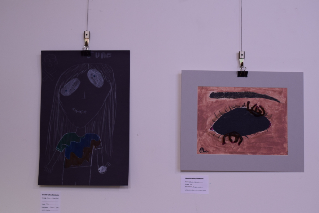 Horror art hanging on a gallery wall