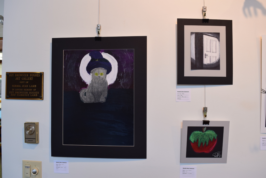 Horror art hanging on a gallery wall