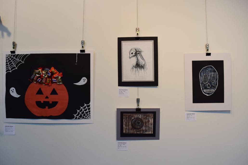 Horror art hanging on a gallery wall